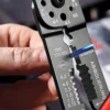 Кліщі для опресування, різання та зачистки 230мм KNIPEX 97 21 215 SB, фосфатовані